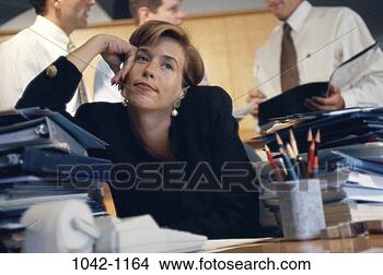 Stock Photo - woman,  daydreaming, 
 hispanic,  business, 
 middle-aged, 
 frustrated. fotosearch 
- search stock 
photos, pictures, 
images, and photo 
clipart
