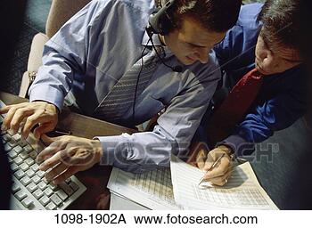Stock Photo - men, people, desk, 
headset, coworkers, 
typing, consulting. 
fotosearch - search 
stock photos, 
pictures, images, 
and photo clipart