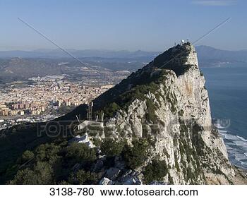 Stock Photography - rock formation 
with a city in 
the background, 
 rock of gibraltar. 
fotosearch - search 
stock photos, 
pictures, images, 
and photo clipart