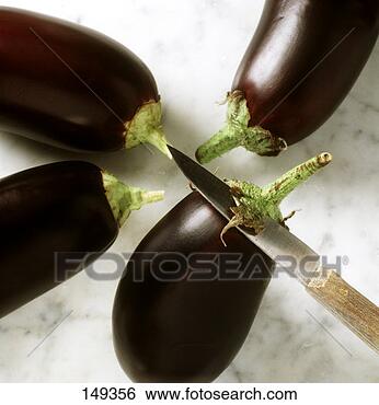 Stock Photo - aubergines, some 
of green on stalk 
removed with a 
knife. fotosearch 
- search stock 
photos, pictures, 
images, and photo 
clipart