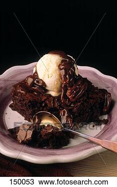 Stock Photo - chocolate cake 
with pecan icing 
& vanilla ice 
cream. fotosearch 
- search stock 
photos, pictures, 
images, and photo 
clipart