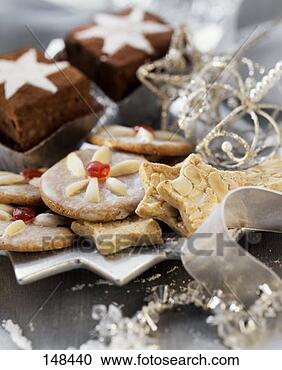 Stock Photography - christmas biscuits 
and brownies with 
silver decoration. 
fotosearch - search 
stock photos, 
pictures, images, 
and photo clipart