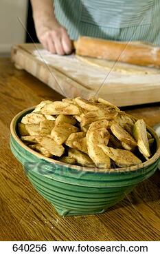 Stock Photo - sliced apples 
in a bowl tossed 
with cinnamon 
and spices. fotosearch 
- search stock 
photos, pictures, 
images, and photo 
clipart