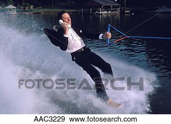 Stock Photograph - a businessman 
wearing a suit 
and tie talking 
on a cordless 
phone. fotosearch 
- search stock 
photos, pictures, 
images, and photo 
clipart