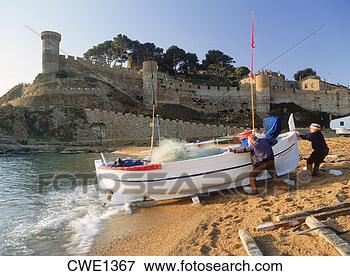 Picture - fishermen at tossa 
de mar in girona 
province of spain 
at sunrise. fotosearch 
- search stock 
photos, pictures, 
images, and photo 
clipart