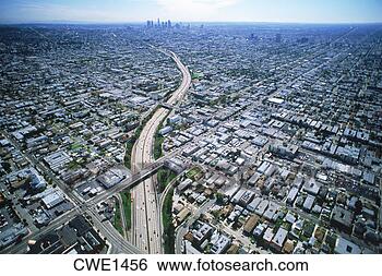 Stock Photo - aerial view of 
freeway cutting 
through los angeles 
urban sprawl. 
fotosearch - search 
stock photos, 
pictures, images, 
and photo clipart