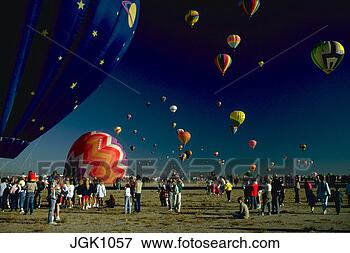 Picture - crowds of people 
standing at hot 
air balloon festival 
as balloons are. 
fotosearch - search 
stock photos, 
pictures, images, 
and photo clipart