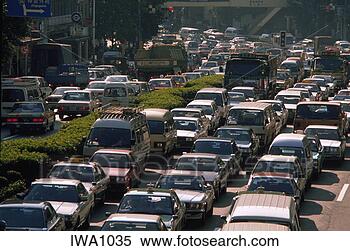 Stock Image - mid-day traffic 
along a city street, 
aoyama district, 
tokyo, japan. 
fotosearch - search 
stock photos, 
pictures, images, 
and photo clipart