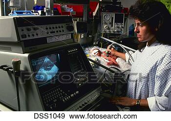 Stock Photograph - technician performs 
ultrasound on 
pre-mature infant 
in hospital. fotosearch 
- search stock 
photos, pictures, 
images, and photo 
clipart