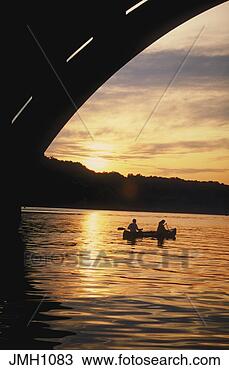 Stock Photo - two people silhouetted 
in a canoe,  just 
after sunset  
taken on the. 
fotosearch - search 
stock photos, 
pictures, images, 
and photo clipart