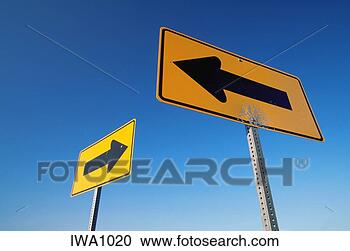 Stock Photography - two yellow directional 
signs with arrows 
pointing in opposite. 
fotosearch - search 
stock photos, 
pictures, images, 
and photo clipart