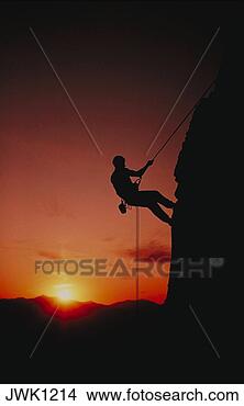 Stock Photo - silhouette of 
mountian climber. 
fotosearch - search 
stock photos, 
pictures, images, 
and photo clipart
