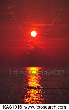 Stock Photo - silhouette of 
a small boat in 
the ocean at sunset 
with sun reflecting. 
fotosearch - search 
stock photos, 
pictures, images, 
and photo clipart
