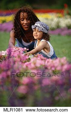 Stock Photography - african american 
woman and daughter 
in garden. fotosearch 
- search stock 
photos, pictures, 
images, and photo 
clipart