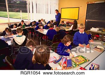 Stock Photo - children studying 
inside junior 
school classroom 
in hixon village. 
fotosearch - search 
stock photos, 
pictures, images, 
and photo clipart