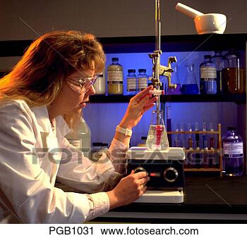 Stock Photography - a female laboratory 
technician wearing 
a lab coat and 
safety glasses. 
fotosearch - search 
stock photos, 
pictures, images, 
and photo clipart