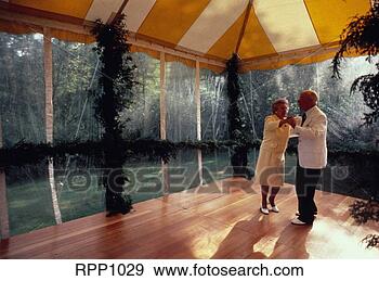 Stock Photograph - older couple dancing 
in tent at wedding 
reception. fotosearch 
- search stock 
photos, pictures, 
images, and photo 
clipart
