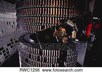 Stock Photo - a robotic arm 
retrieves mci 
corporation customer 
telephone call. 
fotosearch - search 
stock photos, 
pictures, images, 
and photo clipart