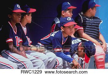 Stock Photograph - young baseball 
players watch 
action from the 
bench, caracas, 
venezuela. fotosearch 
- search stock 
photos, pictures, 
images, and photo 
clipart