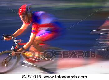 Stock Photo - man riding bicycle 
during race, with 
blurred effect 
to show speed. 
fotosearch - search 
stock photos, 
pictures, images, 
and photo clipart