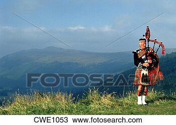 Stock Photo - scottish highlands 
bagpiper near 
loch broom, scotland. 
fotosearch - search 
stock photos, 
pictures, images, 
and photo clipart