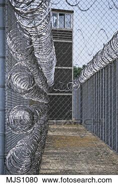 Stock Photography - view of prison 
guard tower as 
seen from between 
two high,  razor 
wire. fotosearch 
- search stock 
photos, pictures, 
images, and photo 
clipart