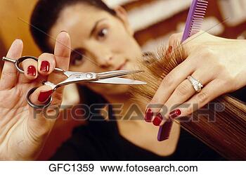 Stock Photograph - close-up of a 
female stylist 
cutting hair. 
fotosearch - search 
stock photos, 
pictures, images, 
and photo clipart