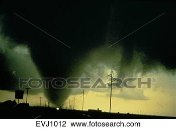 Stock Photo - noaa photo of 
a fat,  conical, 
 tornado touching 
ground between 
power. fotosearch 
- search stock 
photos, pictures, 
images, and photo 
clipart