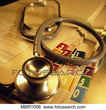 Stock Photo - a doctor’s stethescope 
laying on a pile 
of patient’s medical 
charts. fotosearch 
- search stock 
photos, pictures, 
images, and photo 
clipart