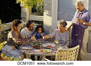 Stock Photography - three generations 
of an african-american 
family eating 
outdoors on. fotosearch 
- search stock 
photos, pictures, 
images, and photo 
clipart