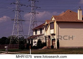 Stock Image - aluminum clad 
suburban home 
beside high tension 
power lines. fotosearch 
- search stock 
photos, pictures, 
images, and photo 
clipart