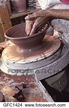 Stock Photo - close-up of a 
potter's hands 
as they make smooth 
the inside of 
a clay. fotosearch 
- search stock 
photos, pictures, 
images, and photo 
clipart