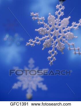 Stock Photography - a hand-crafted 
snowflake decoration 
suspended in a 
studio other. 
fotosearch - search 
stock photos, 
pictures, images, 
and photo clipart