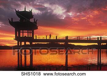 Stock Photo - silhouette of 
chinese pagoda 
at sunrise near 
kunming, southern 
china. fotosearch 
- search stock 
photos, pictures, 
images, and photo 
clipart