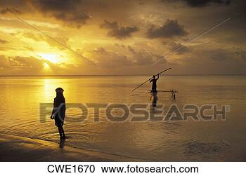 Stock Photography - outrigger canoe 
in aitutaki lagoon 
at sunset with 
polynesian girl. 
fotosearch - search 
stock photos, 
pictures, images, 
and photo clipart