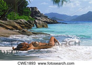 Stock Photo - woman on sandy 
shore painted 
by waves in seychelles. 
fotosearch - search 
stock photos, 
pictures, images, 
and photo clipart