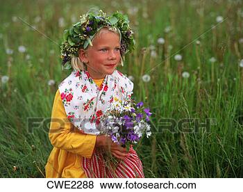 Stock Photo - young swedish 
girl in traditional 
midsummer dress 
collecting wild. 
fotosearch - search 
stock photos, 
pictures, images, 
and photo clipart
