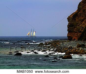 Stock Photography - sailboat in the 
distance as seen 
at dana point 
headlands, ca. 
fotosearch - search 
stock photos, 
pictures, images, 
and photo clipart