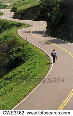 Stock Photo - businessman alone 
on winding highway 
1 along california 
coast. fotosearch 
- search stock 
photos, pictures, 
images, and photo 
clipart