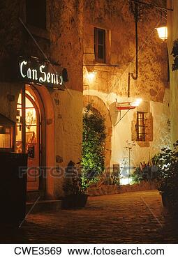 Stock Photograph - street and restaurant 
in tossa de mar 
in girona province 
catalonia. fotosearch 
- search stock 
photos, pictures, 
images, and photo 
clipart