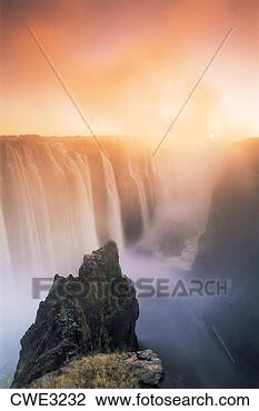 Stock Photo - victoria falls 
from zambia side 
of zambizi river 
at sunrise. fotosearch 
- search stock 
photos, pictures, 
images, and photo 
clipart