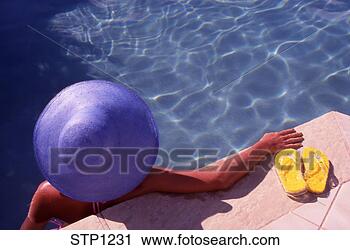 Stock Photography - young woman relaxing 
in a swimming 
pool tortola british 
virgin. fotosearch 
- search stock 
photos, pictures, 
images, and photo 
clipart