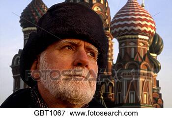Picture - portrait of a 
russian man standing 
in front of saint 
basil cathedral. 
fotosearch - search 
stock photos, 
pictures, images, 
and photo clipart