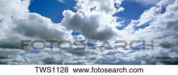 Stock Photo - cumulus clouds 
float in deep 
blue sky,  theodore 
roosevelt national. 
fotosearch - search 
stock photos, 
pictures, images, 
and photo clipart