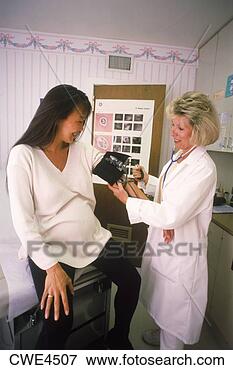 Picture - nurse checking 
blood pressure 
of pregnant woman 
at medical clinic. 
fotosearch - search 
stock photos, 
pictures, images, 
and photo clipart
