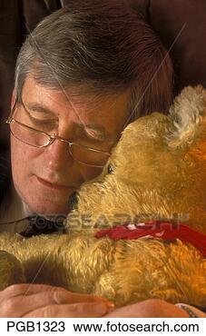 Stock Photo - businessman asleep 
with his teddybear. 
fotosearch - search 
stock photos, 
pictures, images, 
and photo clipart