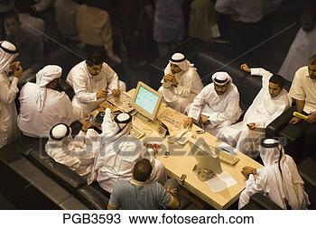 Stock Photo - colleagues meet 
at a table in 
the concourse 
of  the dubai 
financial. fotosearch 
- search stock 
photos, pictures, 
images, and photo 
clipart