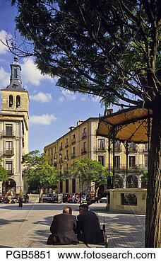 Stock Photography - old men sitting 
on bench in a 
square in old 
town of segovia 
castile. fotosearch 
- search stock 
photos, pictures, 
images, and photo 
clipart
