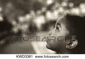 Stock Photography - view of a small 
girl looking upwards. 
fotosearch - search 
stock photos, 
pictures, images, 
and photo clipart