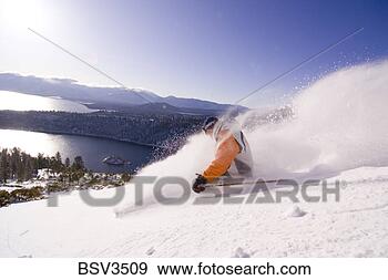 Stock Photograph - a man skiing powder 
snow at sunrise 
above emerald 
bay on lake tahoe. 
fotosearch - search 
stock photos, 
pictures, images, 
and photo clipart